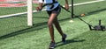 Runner pulling a sled with weights on a green turf field Royalty Free Stock Photo