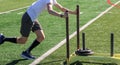 Runner pushing a sled with weights on a turf field Royalty Free Stock Photo