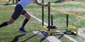 Runner pushing a sled with weights on a turf field Royalty Free Stock Photo