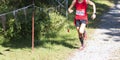 Runner racing 5K on dowhill at Bowdoin Park Royalty Free Stock Photo