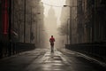 Runner in a red t-shirt running on empty and silence street in foggy morning, sport and healthy lifestyle