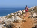 Runner on rocky coast above the sea Royalty Free Stock Photo