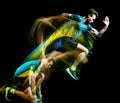 Runner running jogger jogging man isolated light painting black background Royalty Free Stock Photo