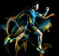 Runner running jogger jogging man isolated light painting black background Royalty Free Stock Photo