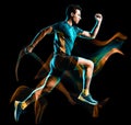 Runner running jogger jogging man isolated light painting black background Royalty Free Stock Photo