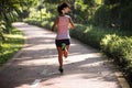 Runner running on morning park road workout jogging Royalty Free Stock Photo