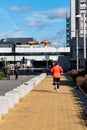 Runner running on pedestrian walkway in Cuatro Torres in Madrid