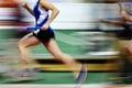 Runner Running a Race on Track with Baton Relay Team Score