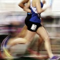 Runner Running a Race on Track with Baton Relay Team Score Blur Motion Royalty Free Stock Photo