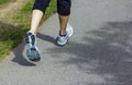 Runner - running shoes closeup on runners shoes feet running on road fitness jog workout healthy lifestyle fitness jogging Royalty Free Stock Photo