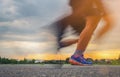 Runner`s Feet, Motion Blurred runner closeup shot runner running at a fast pace background sky sunlight