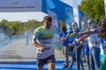 Runner showered with blue powder Royalty Free Stock Photo