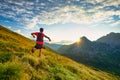 Runner skyrunner on a mountain meadow at dawn Royalty Free Stock Photo