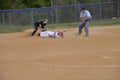 Batter slides inbefore the tag in a high school softball game