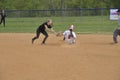 Batter slides inbefore the tag in a high school softball game