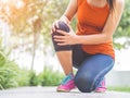 Runner sport knee injury. Woman in pain while running