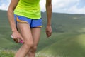 Runner spraying insect repellents on skin outdoors
