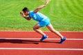 Runner sprint race at stadium. How to start running. Boost speed concept. Man athlete runner push off starting position Royalty Free Stock Photo