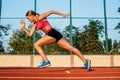 Runner sprinting towards success on run path running athletic track. Goal achievement concept.