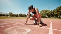 Runner, stadium and fitness with woman start for running race, training and cardio on outdoor track. Competition Royalty Free Stock Photo