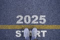 Runner standing at the starting point with 2025 year for starting in new year 2025 to achieve business planing and success concept