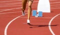 Runner in start position prepares for the start. Individual sport conept