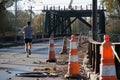 runner stopping abruptly at a closedoff bridge under repair