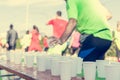 Runner taking a cup of water at H20 stand.