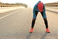 Runner taking a rest after running city road