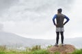 Runner thinking, fitness and man in nature for training , wellness or outdoor adventure for health. Athlete, back or Royalty Free Stock Photo