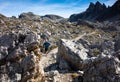 Runner training in Italian Dolomites on a rocky trail