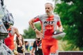 The runner after the transition to cycling. Triathlete man running in triathlon suit training for ironman race