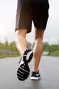 Runner wearing sneakers and shorts