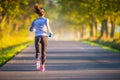 Runner woman in autumn park tree alley training in sports thermal underwear Royalty Free Stock Photo