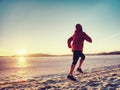 Runner woman feet running on offshore. Female fitness