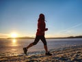 Runner woman feet running on offshore. Female fitness Royalty Free Stock Photo