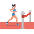 Runner woman at the finish line. Sprinting athlete at the finish with a winning tape. Royalty Free Stock Photo