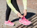 Runner woman lacing trainers shoes Royalty Free Stock Photo