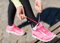 Runner woman lacing trainers shoes Royalty Free Stock Photo