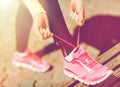 Runner woman lacing trainers shoes Royalty Free Stock Photo