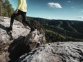 Runner in yellow green shinning  jacket and black leggings Royalty Free Stock Photo