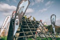 Runners climbing wall in a test of extreme obstacle race