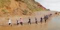 Runners crossing the stream in Branscombe