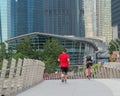 Runners and cyclists exercise in the morning Royalty Free Stock Photo