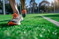 runners feet with sports shoes on artificial turf, midstride Royalty Free Stock Photo