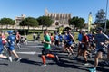 Runners during palma half marathon passing next to palma cathedral