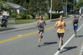 Runners passing the mile mark