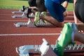 Runners preparing for race at starting blocks Royalty Free Stock Photo