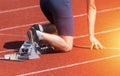 Runners preparing for race at starting blocks. Sunny day Royalty Free Stock Photo