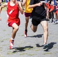 Runners racing to the finish to win high school cross country race